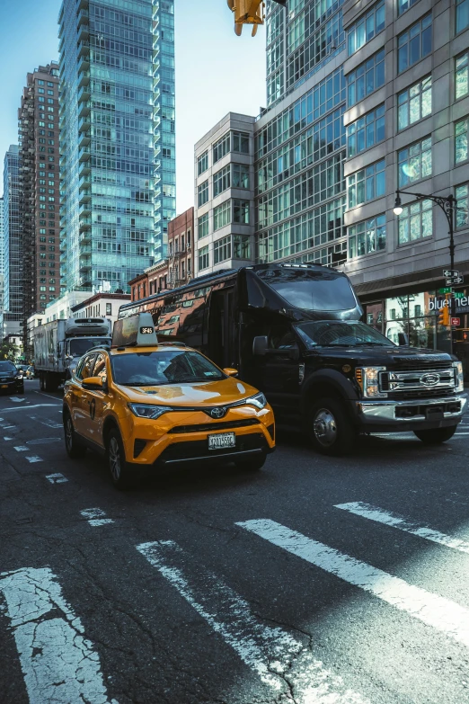 a truck and a car on a busy city street