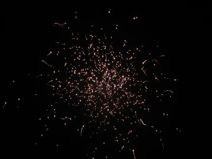 fireworks are shown in the dark with black background