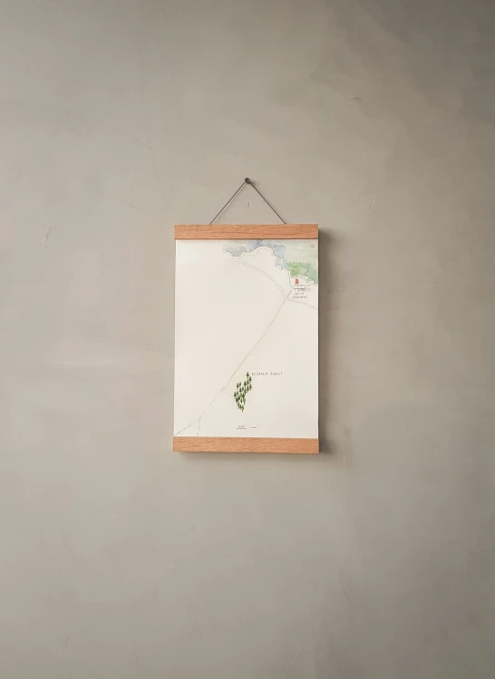 there is a drawing hanging from a frame on the wall