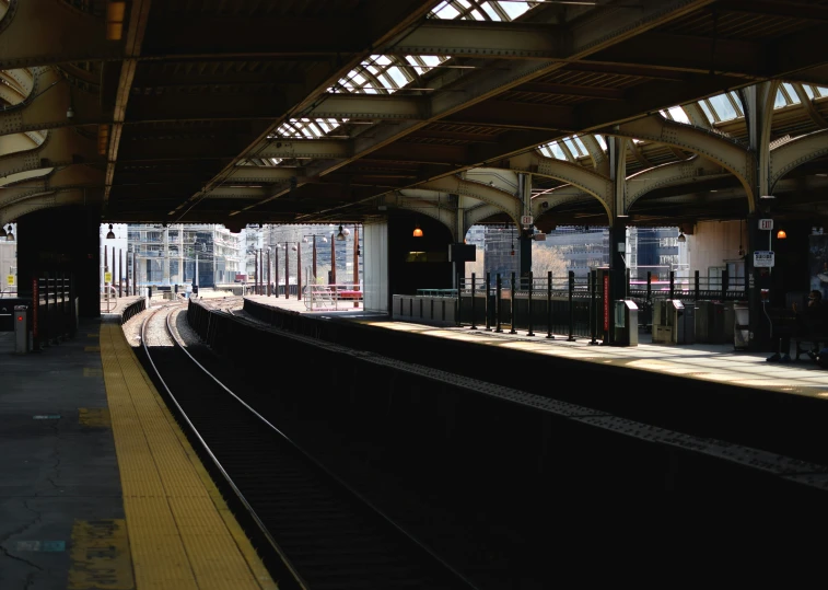 view of train tracks from inside the train station