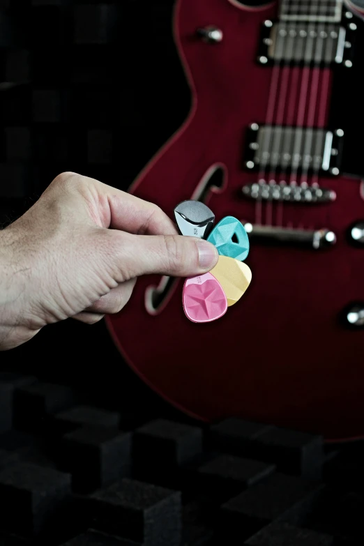 a person with two pieces of paper cut into the shape of a heart