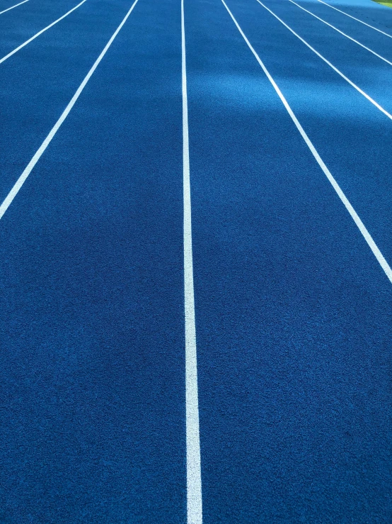 a line of blue running tracks, running away