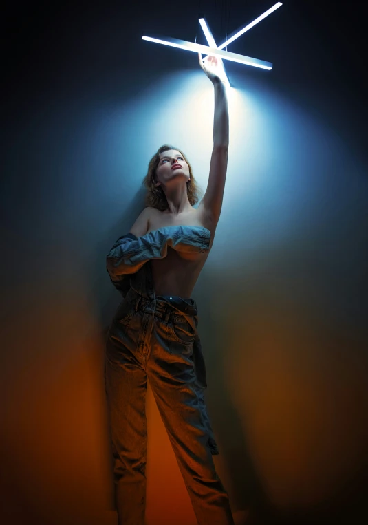 a woman standing in a room with a bright light