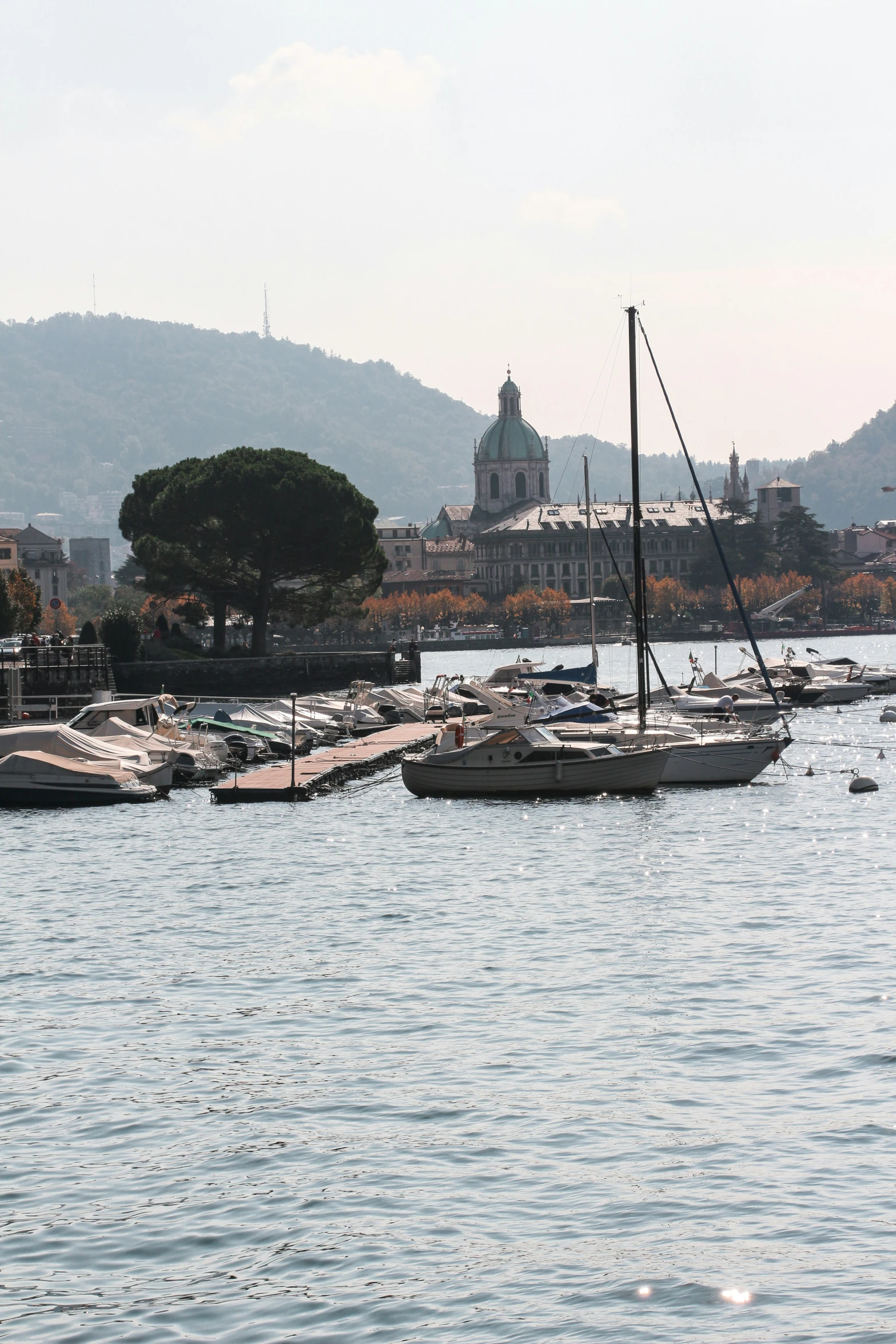 a harbor is lined with boats parked in it