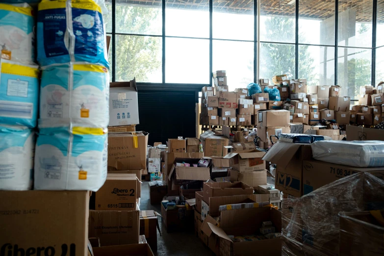 boxes are stacked together with a large amount of cloth