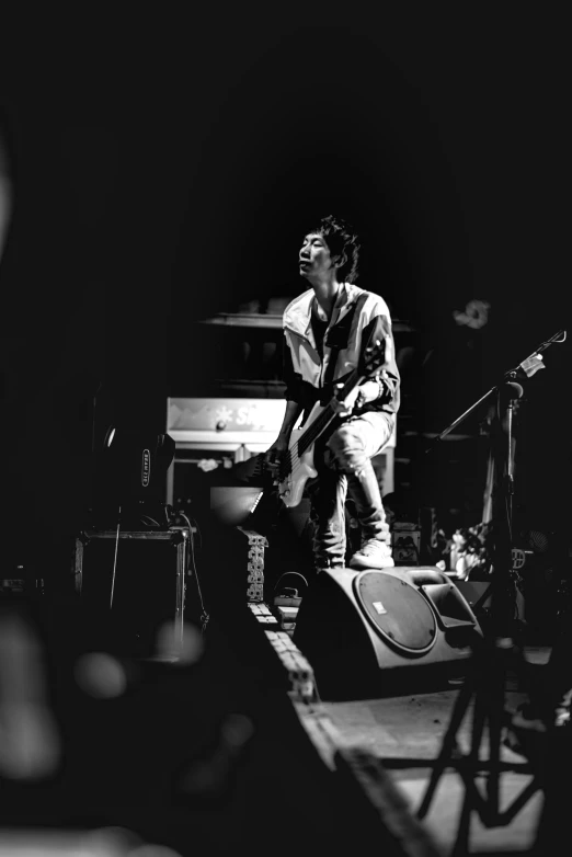 a male singer on stage with a microphone