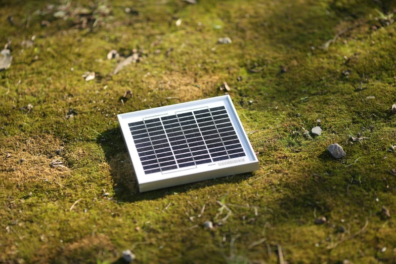 solar panel on grass laying on the ground