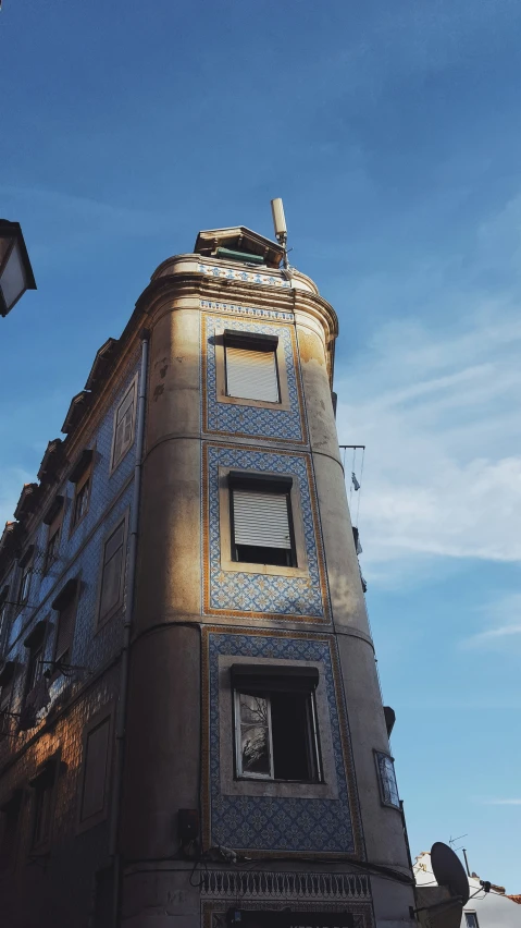 the corner of an old building with lightening on the window