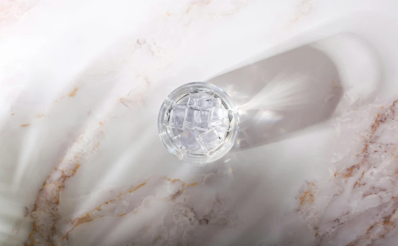 this is an image of a glass bottle on marble