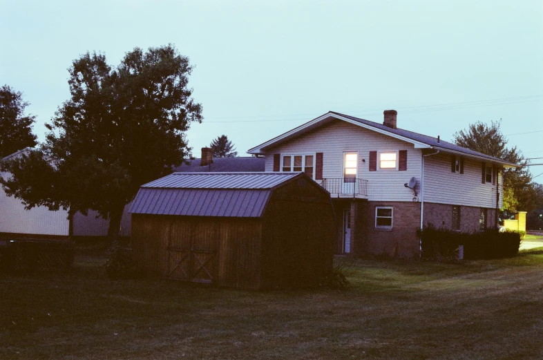 a dark barn has two windows in it