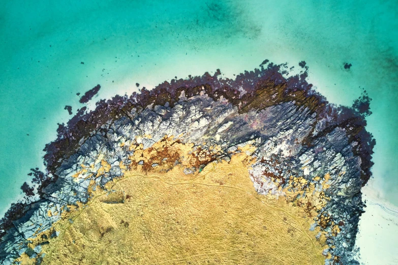 a very close - up view of a bird's eye view of the sand and water