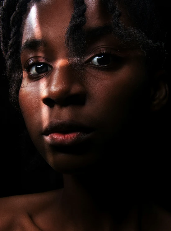 a woman with dreadlocks posing for a picture