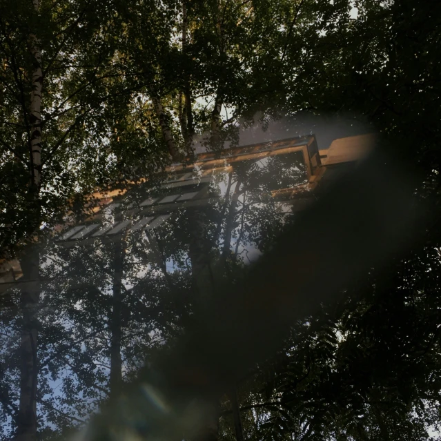 a train traveling past some trees on a train track