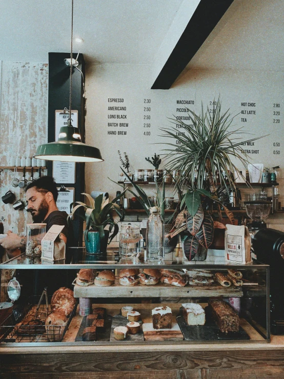 an image of people getting food at the counter