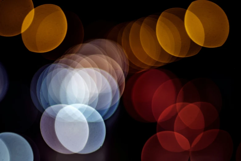 several blurry circles that are in different colors