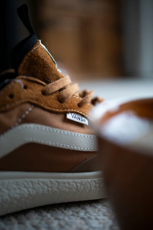 a pair of brown vans sneakers is displayed