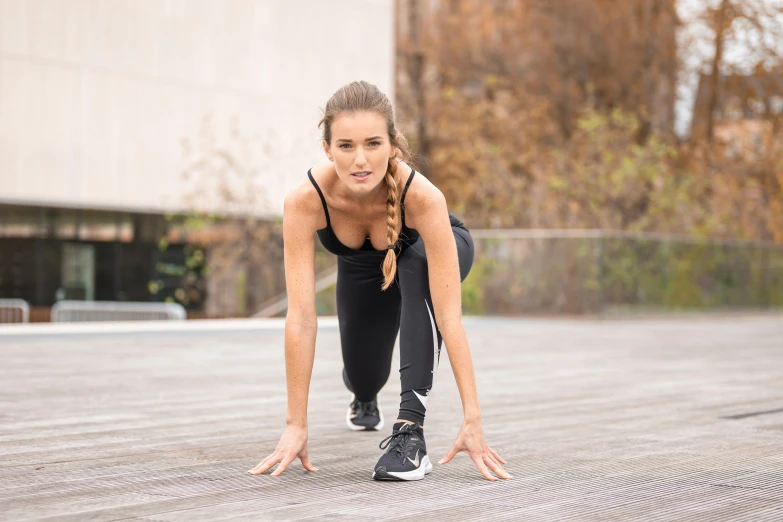 a beautiful young woman performing h up exercises