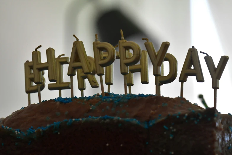 there is a small birthday cake with candles on it