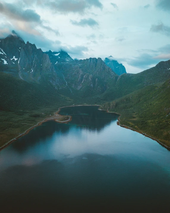 a beautiful view of some mountains and a body of water