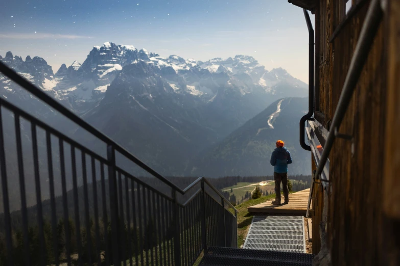 a person is standing at the top of a mountain