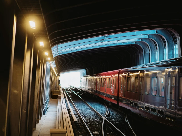 a train is leaving an empty train station