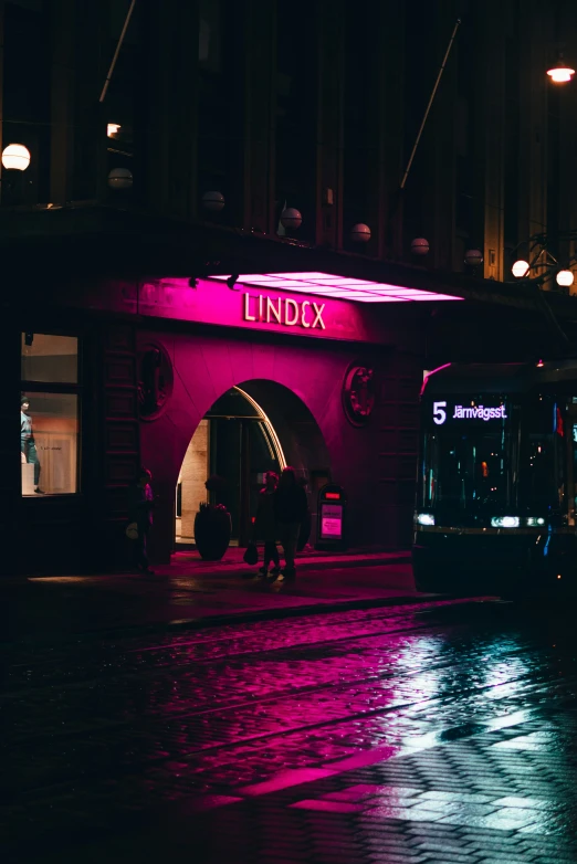 a purple colored lite outside of a store