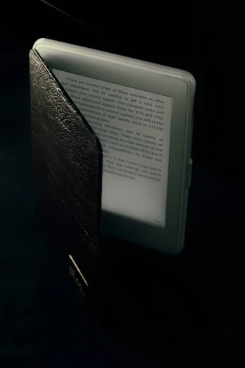 book with light shining on it sitting on a table