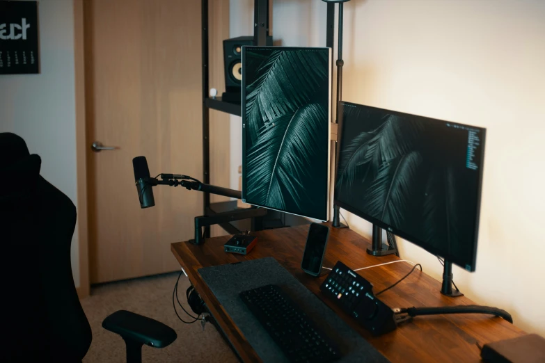 a computer desk with a keyboard and monitor