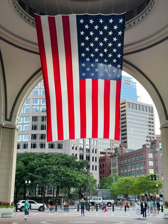 a united states of america flag is seen in the sky