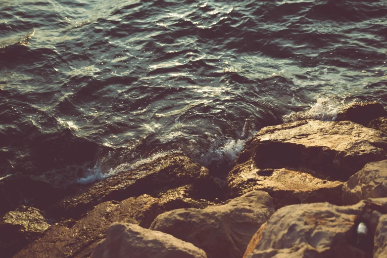 a large body of water with rocky shores