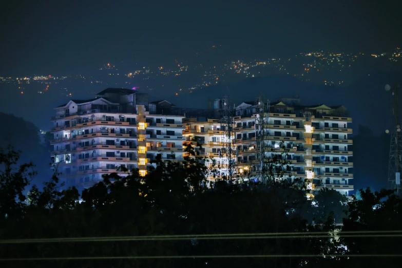 an urban city by night with buildings lit up