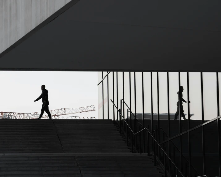 a person walking up some stairs towards a sky