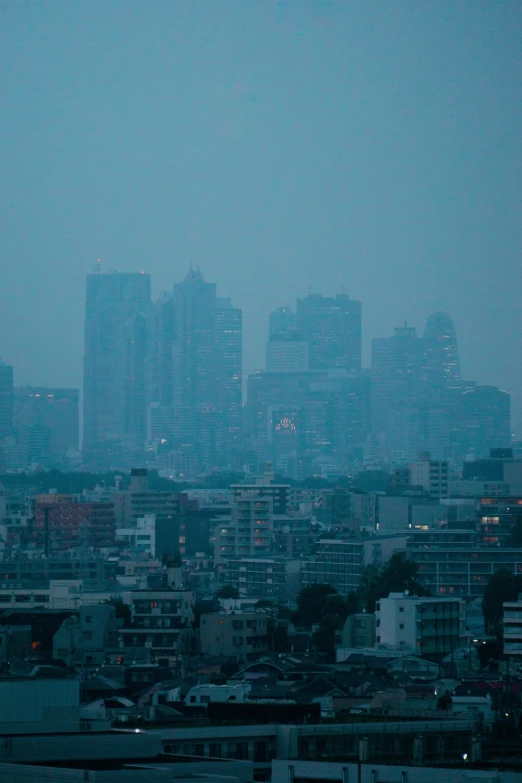 city skyline from a distance in the rain