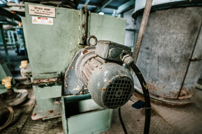 a machine with a blower on the side in a shop