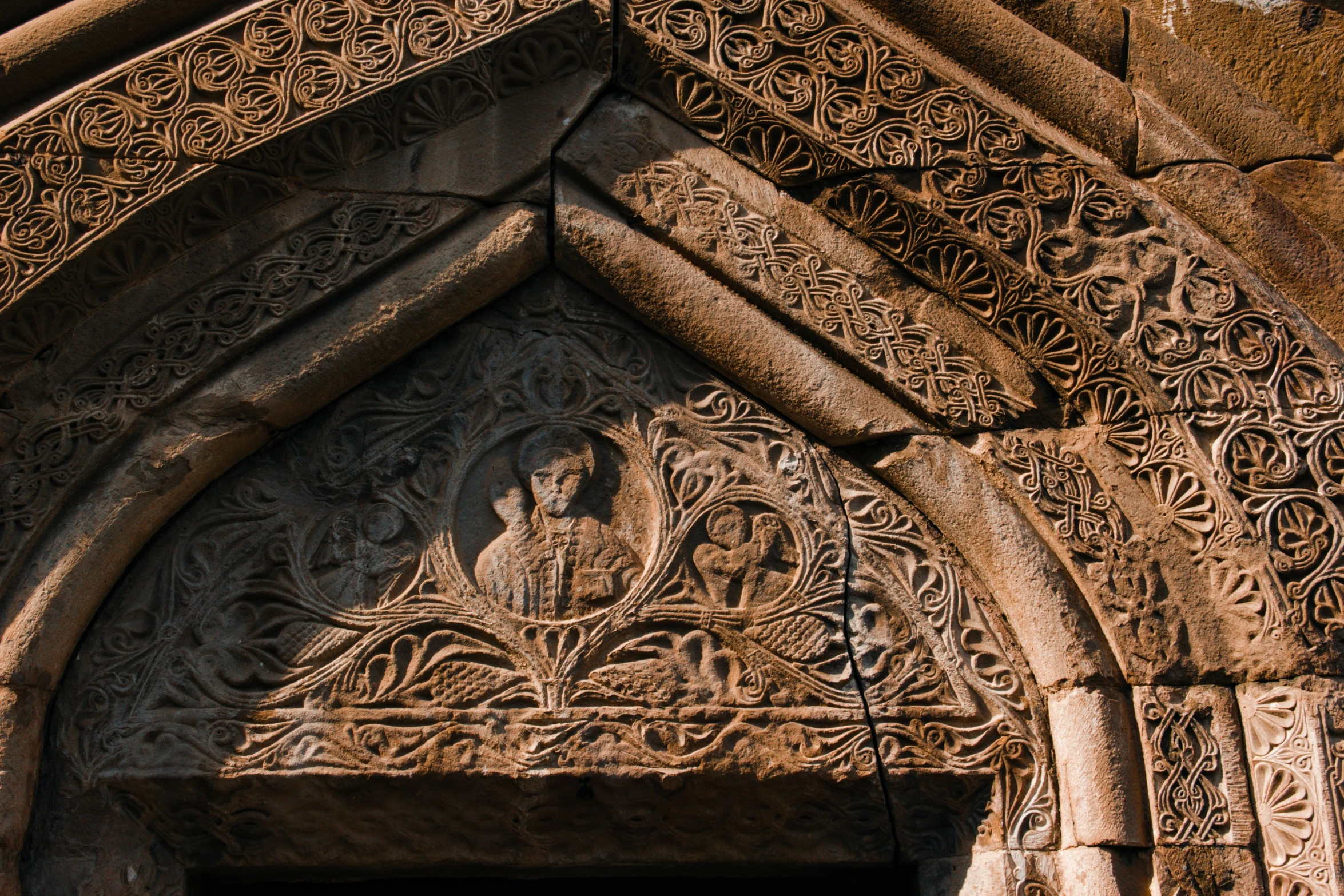 ornate, ornamental architecture on the side of a building