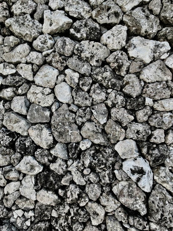 a stone pavement textured with rocks, with gray and white colors