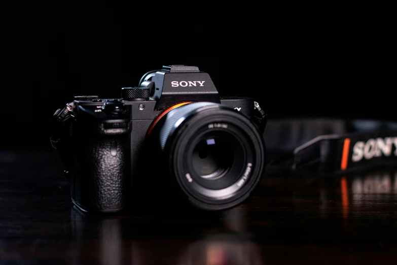 a sony camera on a table in the dark