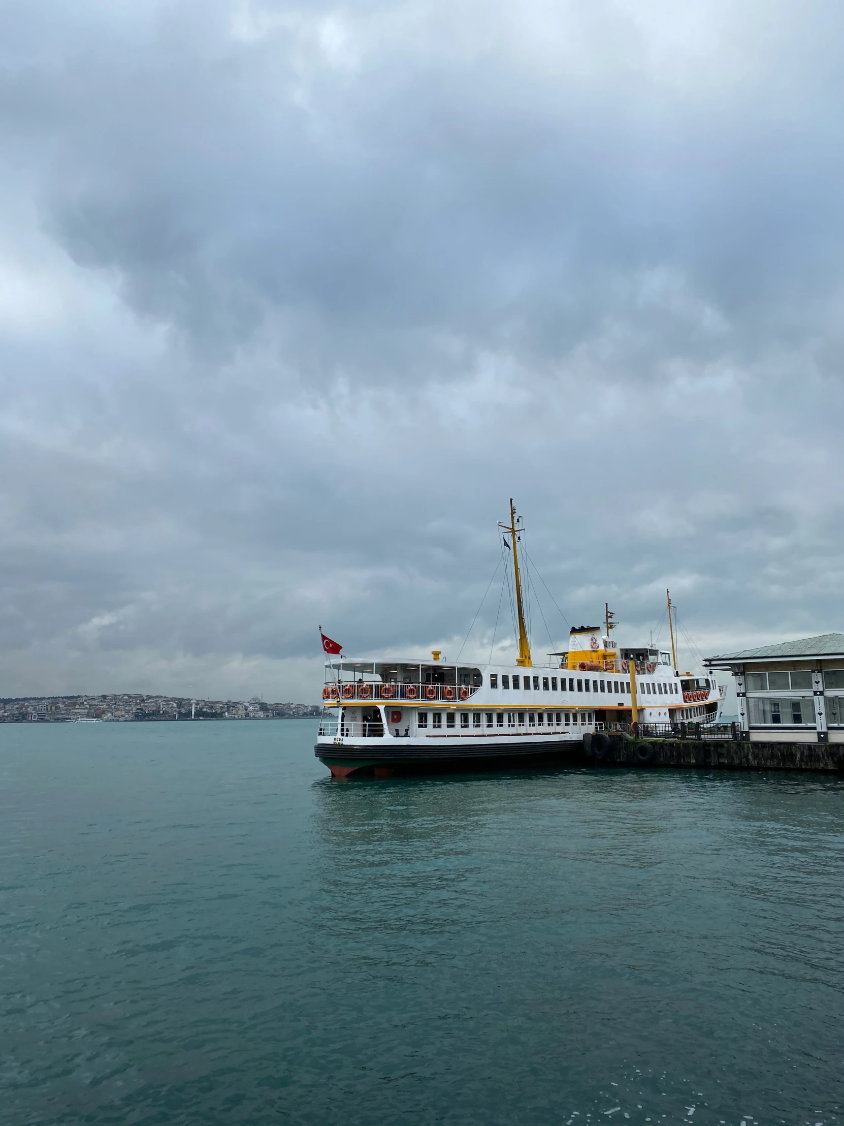 a passenger boat that is parked in a harbor