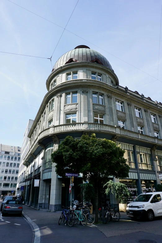 a large domed building sitting on the side of a street