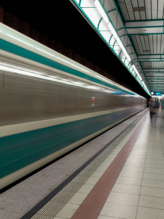 there is a subway train that is at the station