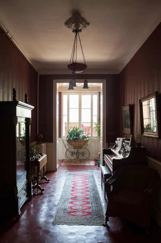 the long hallway has two plants in a vase