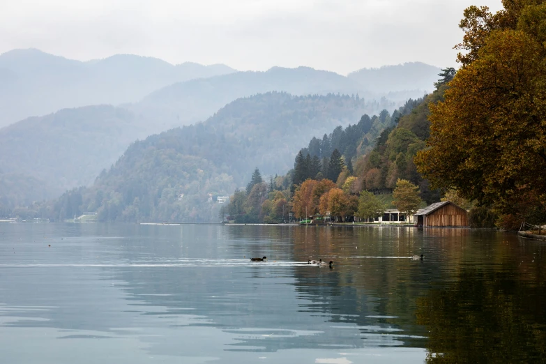 a lake with mountains in the background