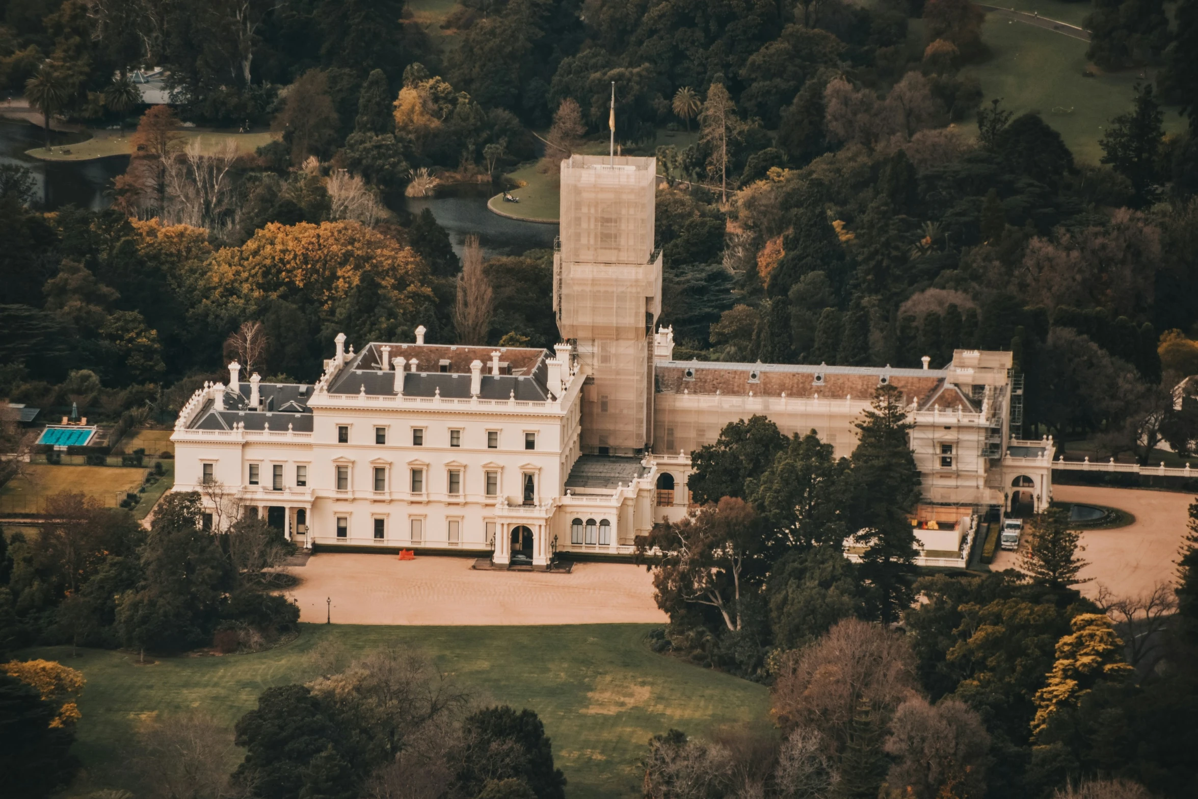 an aerial s shows a large house with several stories