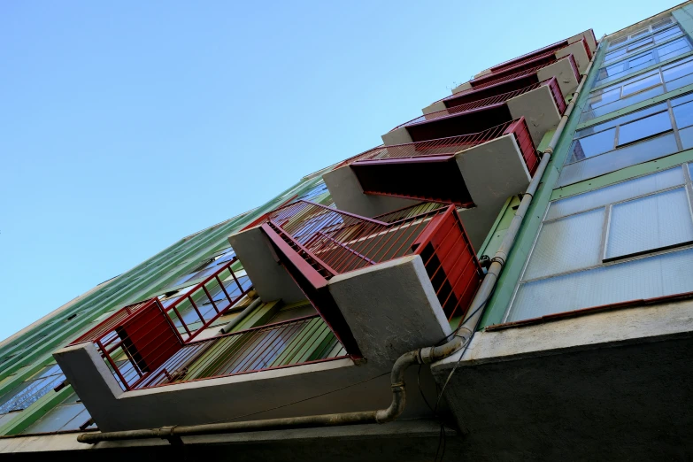 a building's side with an assortment of windows