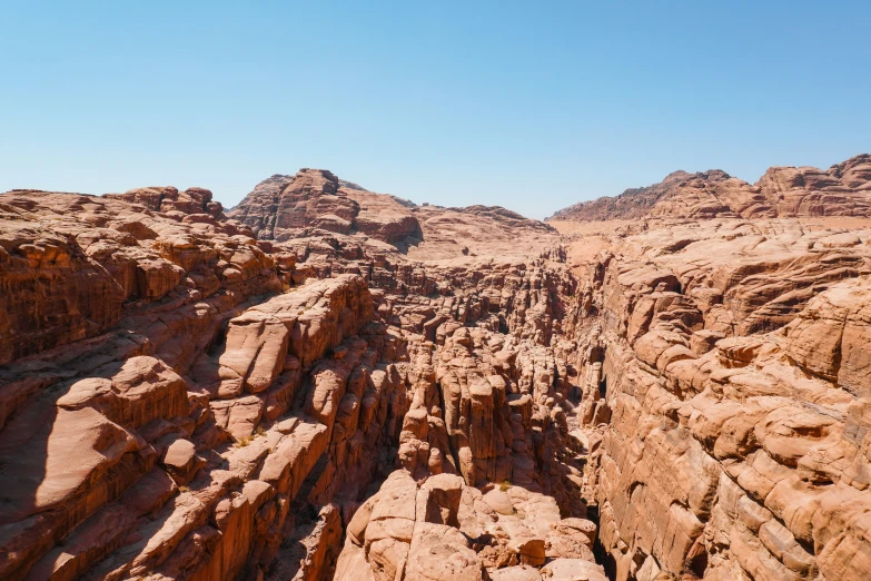 a very large wide open area with tall rocks