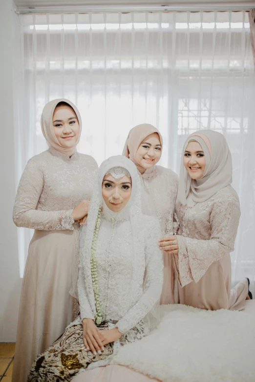 an arabic family poses for the camera in their room