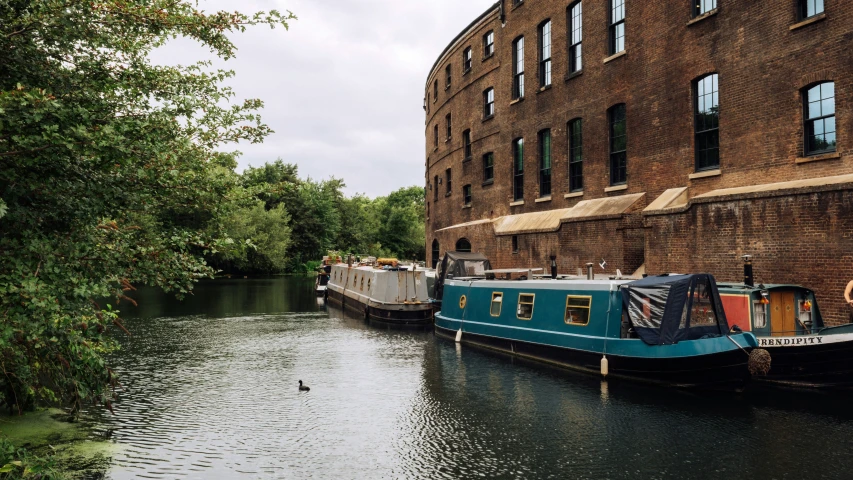 a boat is parked in the river near buildings