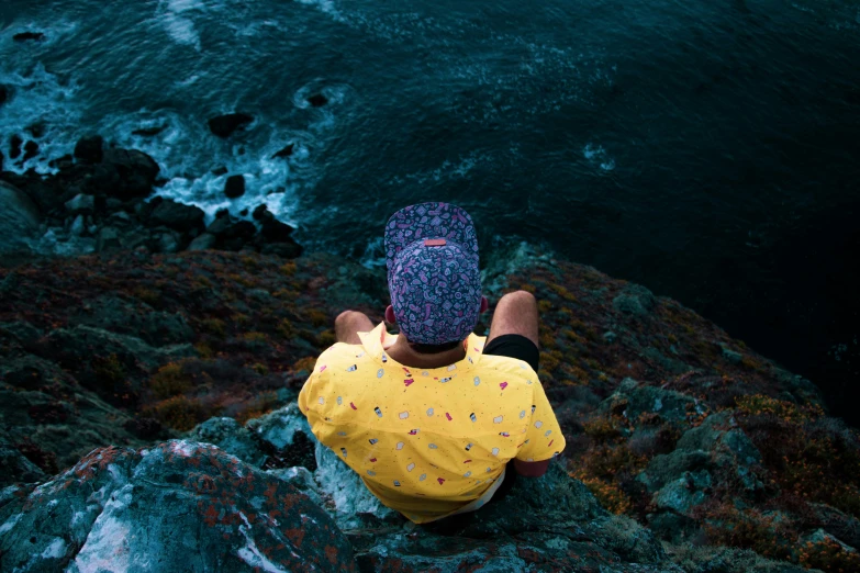 a person that is on top of a rock