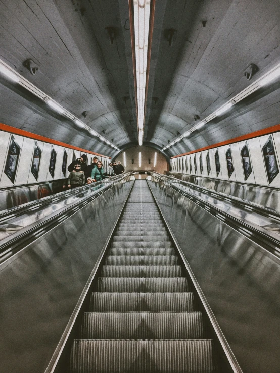 the escalator is empty as it comes down the platform