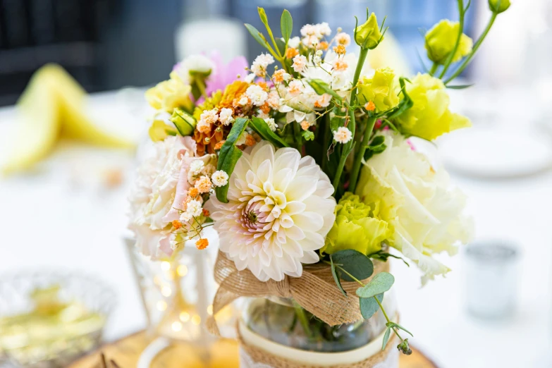 a vase filled with different kinds of flowers